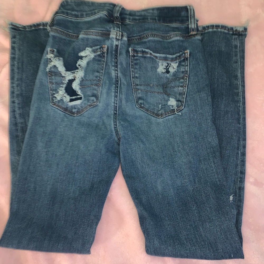 american eagle jeans w/ rips on ankles and thigh area!!